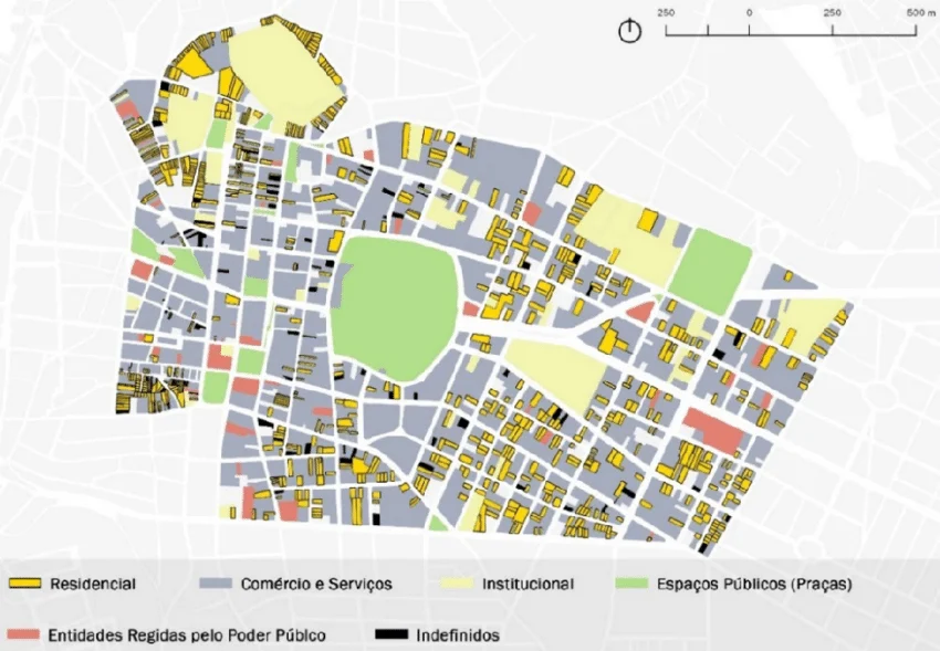 Vista aérea de cidade com áreas residenciais comerciais e industriais organizadas